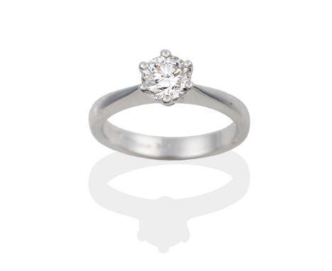 An 18 Carat White Gold Diamond Solitaire Ring, the round brilliant cut diamond in a six claw setting, estimated diamond weigh