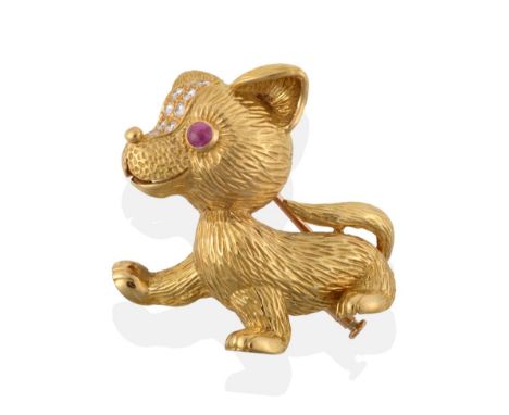 ^ A 1960's Ruby and Diamond Novelty Dog Brooch, by Cartier, modelled in a walking pose, with textured fur, a round cabochon r
