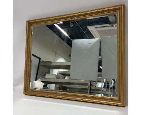 Contemporary gilt bevel-edged wall mirror of rectangular form with beaded decoration, L 113cm x 87.5cm.