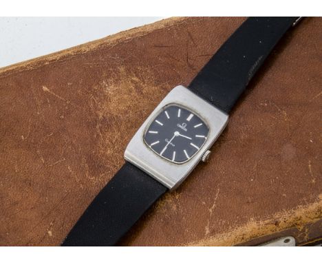 A c1970s Omega stainless steel manual wind mid sized wristwatch, 24mm wide rectangular case, black dial with batons, ticks wh