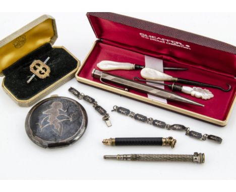 A collection of miscellaneous jewels and accoutrements, including a Siam silver and enamelled compact, bracelet, three mother