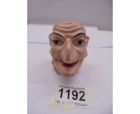 An old Mr Punch hand puppet head.