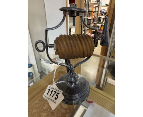 A vintage silver plater 'wax Jack' candlestick.