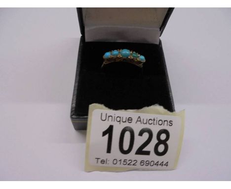 A 9ct gold ring set five turquoise stones, size P half, 2.26 grams.