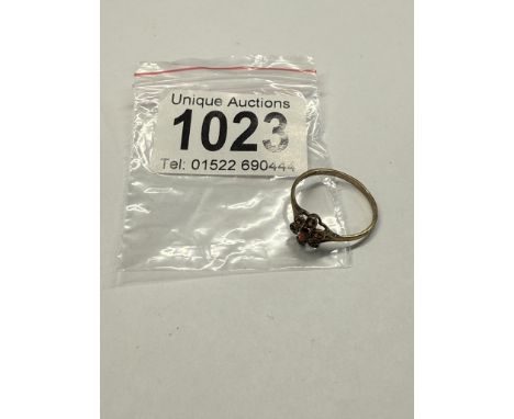 A 9ct gold ring set seven small rubies, size Q, 1.24 grams.