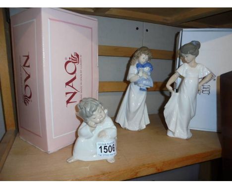 A Lladro figure and two NAO ceramic figures.