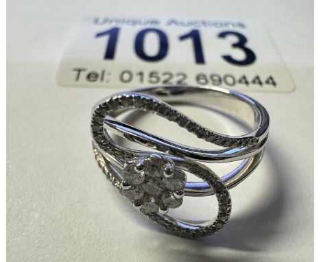 An 18ct white gold fantasy diamond ring. 3.66 grams. Size N