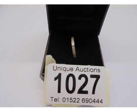 An 18ct white gold ring set diamond chips, size J, 2.11 grams.
