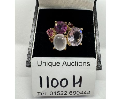 A 9ct coloured stone ring. Size K