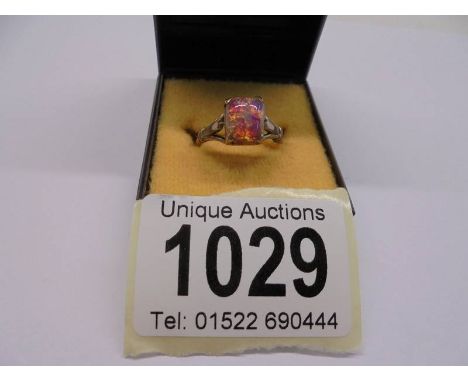 A 9ct gold ring set multi-coloured stone, size P, 3.9 grams.