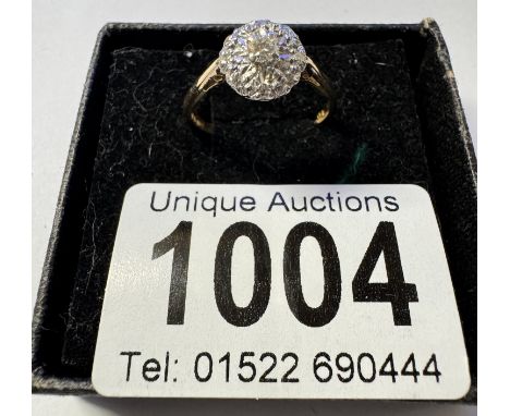 An 18ct yellow gold floral diamond ring. 2.86 grams. Size P