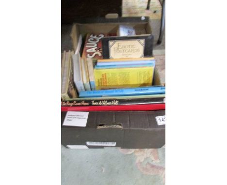 A box of postcard reference books and magazines.