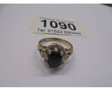 A 9ct gold stone set ring, size K half, 3 grams.