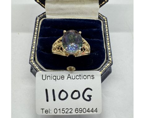 A 9ct gold ring set pale blue stone. Size T half. 5.13 grams