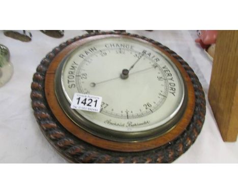 A good barometer with rope twist case.