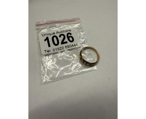 A 9ct gold ring set three amethysts, size M half, 2 grams.