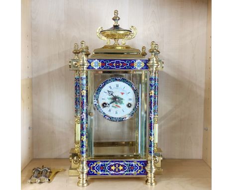 A mercury pendulum enamelled gilt brass striking mantel clock, H. 44 cm.