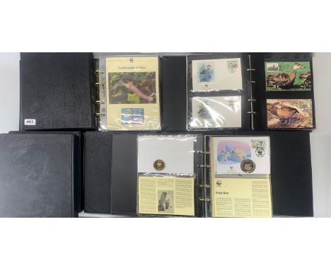Seven albums of WWF first day cover stamps.