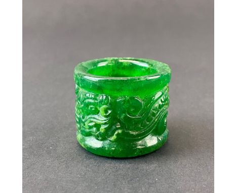 A Chinese carved jade archers ring decorated with a dragon, internal Dia. 2.5cm.