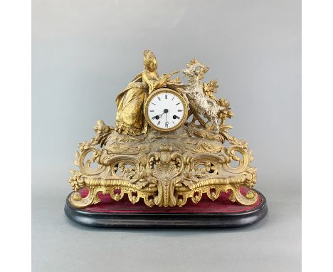 A 19th Century French gilt spelter mantel clock with wooden base. Clock H. 33cm. W.40 cm.