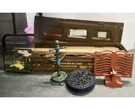 A military metal ammunition box with tool contents and various metal items.