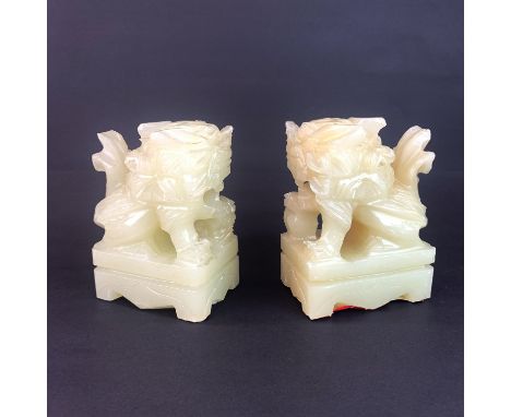 A pair of Chinese jade/hardstone lion dog bookends, H. 13cm.