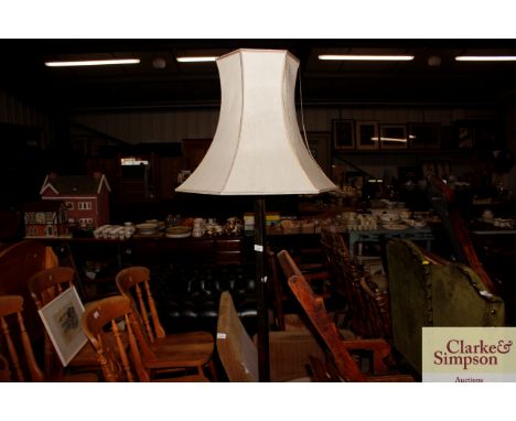 A brass standard lamp and shade 