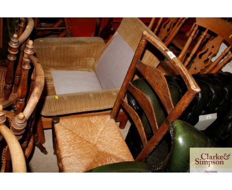 An elm and rush seated ladder back chair