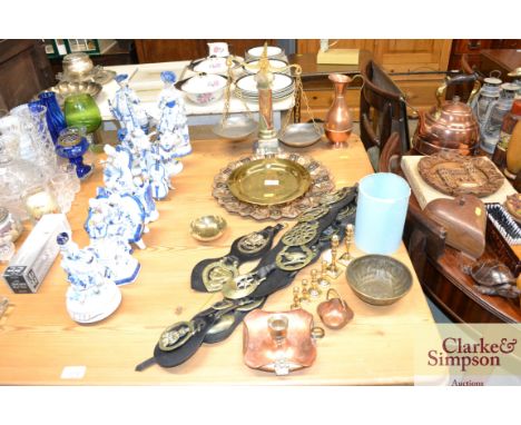 A quantity of various metalware to include leather mounted horse brasses, a copper and brass chamber stick, a set of onyx bal