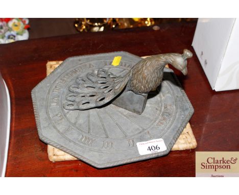 A Tempist Fugit sundial decorated with a peacock