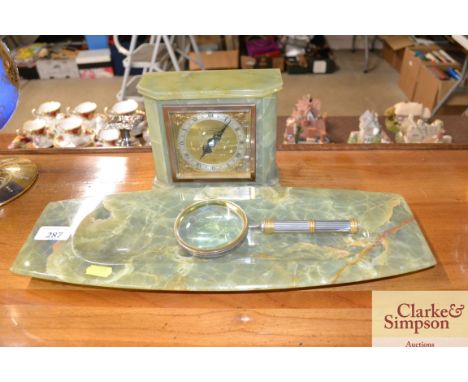 A Boodle &amp; Dunthorne Liverpool, Elliot clock contained in onyx case; and a magnifying glass and onyx dish