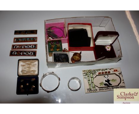 A box containing photograph negatives, Magic Lantern slides, a silver plated napkin ring, an enamel and stone set bangle etc.