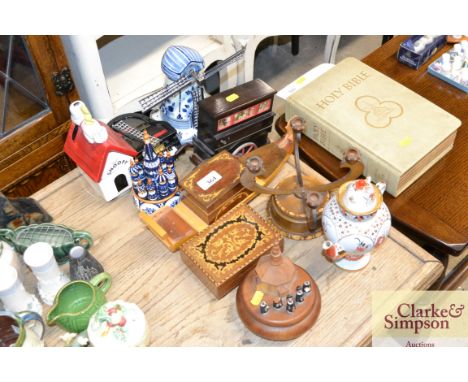 A quantity of wooden items to include a four branch candlestick, a Sorrento ware type boat, and a blue and white windmill AF 