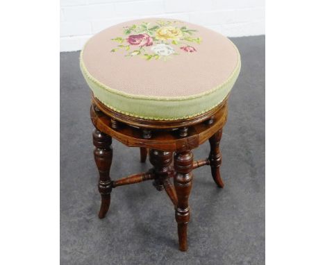 Late 19th / early 20th century mahogany piano stool with a circular tapestry upholstered seat, 50 x 35cm 