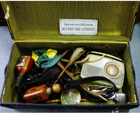 Vintage cabin trunk containing a quantity of miscellaneous horse riding items to include a leather harness, silk riding hat e