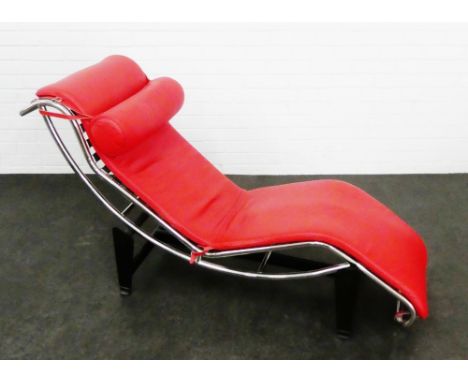 A contemporary Le Corbusier  chaise lounge with  chrome and black metal supports, with detachable red leather upholstered cus