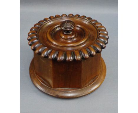 Octagonal fruitwood tea caddy the lid with gadrooned edge, with lead lining and on a circular base, 12cm high  