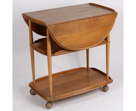 Ercol beech and elm three tier drop leaf serving trolley on castors, 77cm high, 75cm length, 96cm wide when extended.