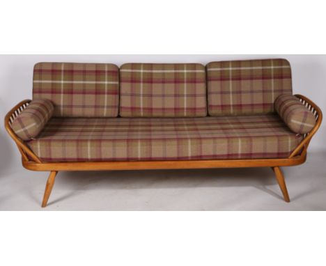 A mid 20th Century Ercol blonde day bed, 206cm x 75cm x 75cm.
