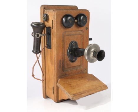 Kellogg wooden cased, wall mounted telephone, circa early 20th Century. With mouth piece to the left hand side, crank handle 
