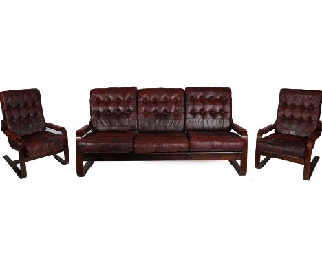 A mid 20th Century Scandinavian leather and bent wood three piece suite, comprising of a three seater sofa and a pair of armc