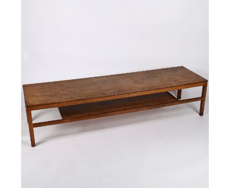 A mid century teak long coffee table with lower shelf. 168cm length, 46cm wide, 38cm tall.