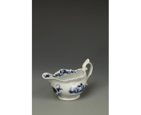 A WORCESTER BLUE AND WHITE PORCELAIN CREAM BOAT, 'Two Porter' pattern with moulded scroll cartouches on pedestal foot, worker