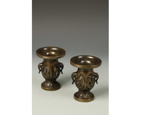 A PAIR OF ORIENTAL SILVER-INLAID BRONZE FLARED VASES, with elephant-mask handles and relief decoration, 19thC, 5" high (2)