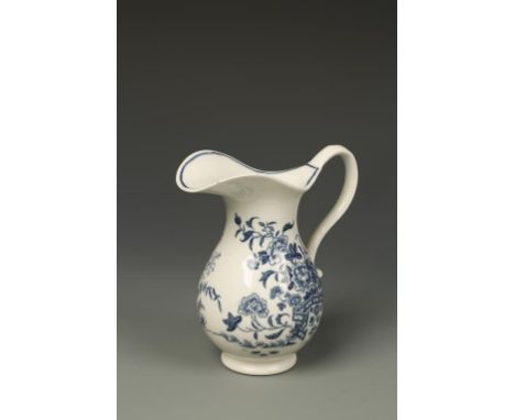 A WORCESTER BLUE AND WHITE PORCELAIN BALUSTER-SHAPED MILK JUG, with scroll handle, 'Fence' pattern, crescent mark on undersid