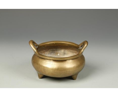 A CHINESE BRONZE TRIPOD CENSER with loop handles, Xuande mark, Ming-Qing, 5.5" wide 