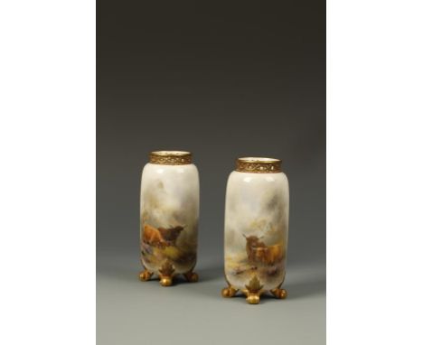 HENRY STINTON FOR ROYAL WORCESTER: A PAIR OF OVOID VASES painted with highland cattle, signed, with gilt scroll acanthus leaf