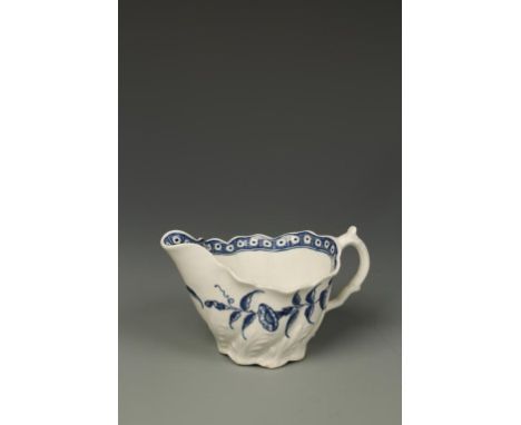 A WORCESTER BLUE AND WHITE PORCELAIN LOW CHELSEA EWER CREAM JUG, 'Convolvulus' pattern on moulded ground, crescent mark on un