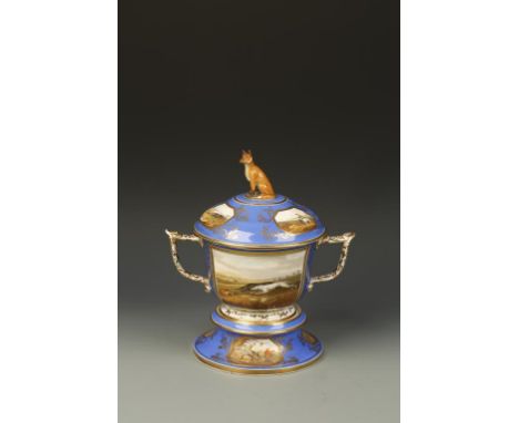 A COALPORT PORCELAIN VASE ON STAND, painted with various hunting scenes, within gilt borders on blue ground, the cover with a