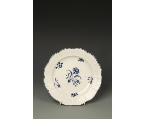 A WORCESTER BLUE AND WHITE PORCELAIN PLATE, 'Gilliflower' pattern, within a basket moulded border, crescent mark on underside